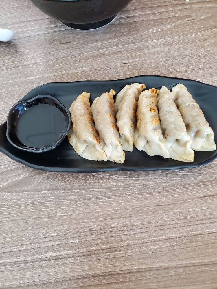 Pan-fried gyoza with dipping sauce